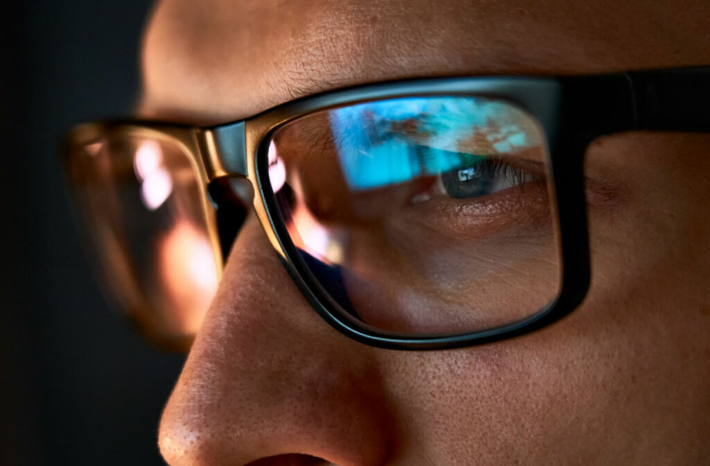 A man is looking at the computer screen and experienced eye strain