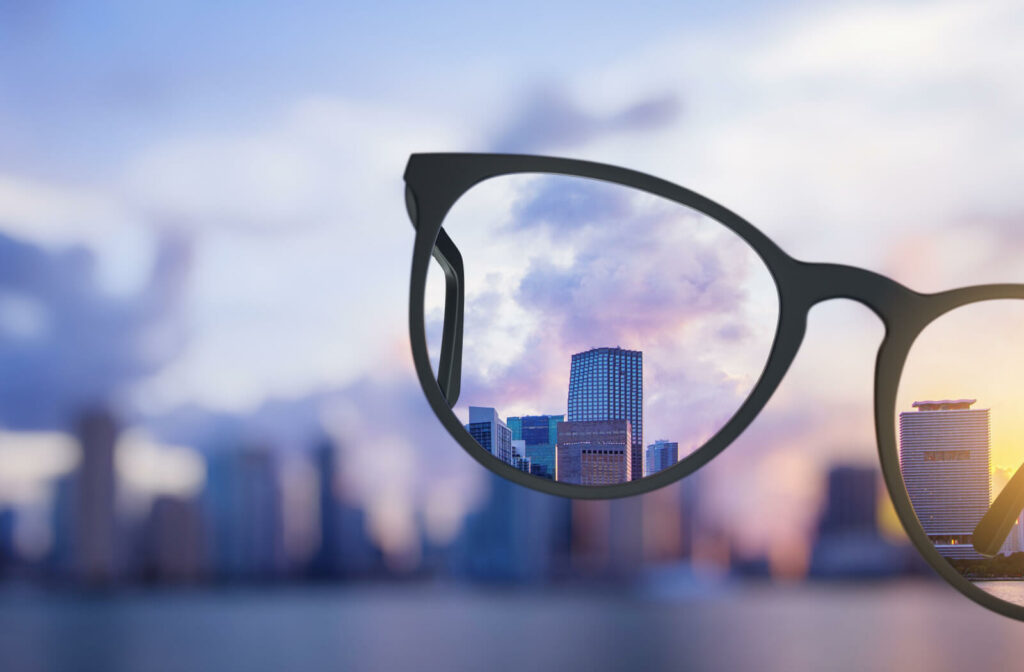 Modern-bright-city-view-through-eyeglasses.-Blurry-background.-Vision-concept