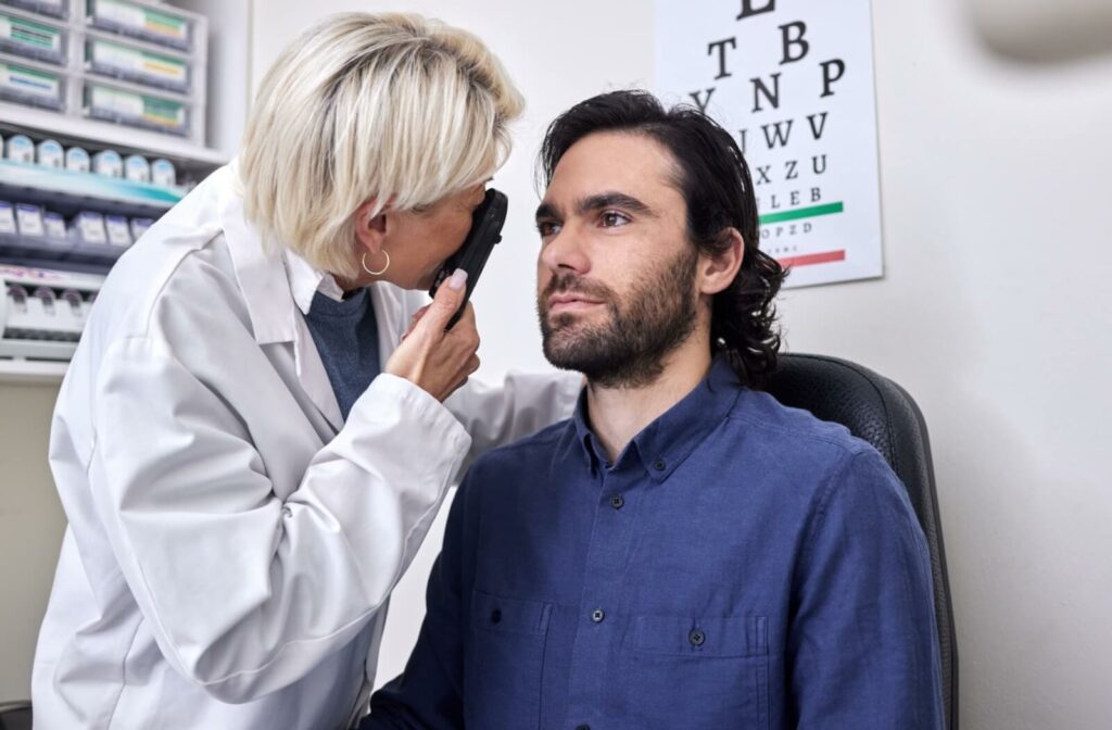 An eye doctor evaluating a patient's symptoms during an eye exam.